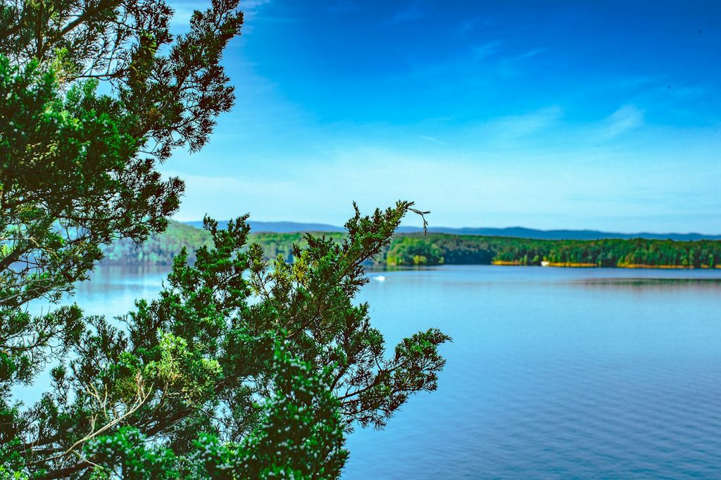 Lake Ouachita, Arkansas, framed by trees along the shore.